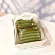 Load image into Gallery viewer, Packaged pandan coconut千層糕, showing layers of green and white layers, indicating the pandan and coconut layers within.